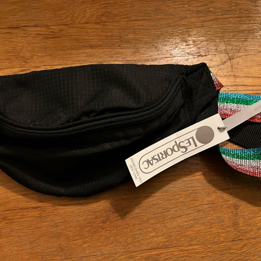 LeSportsac Sling Bag in Black with colorful strap.
